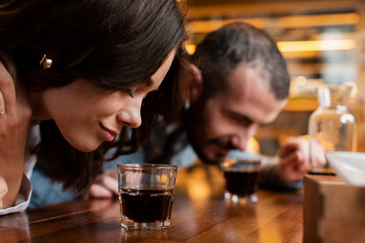 Two people having a coffee tasting at a cafe